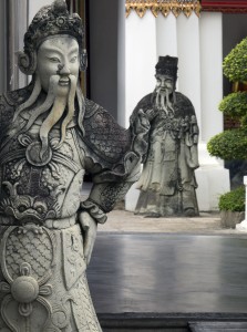 Guarding Wat Pho, the old man watching the young buck and laughing:-)